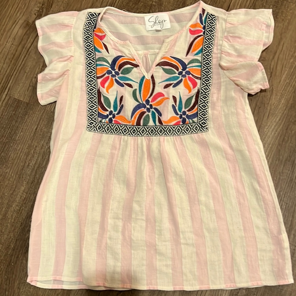 Great top for summer or spring. Very fun colors and patterns.